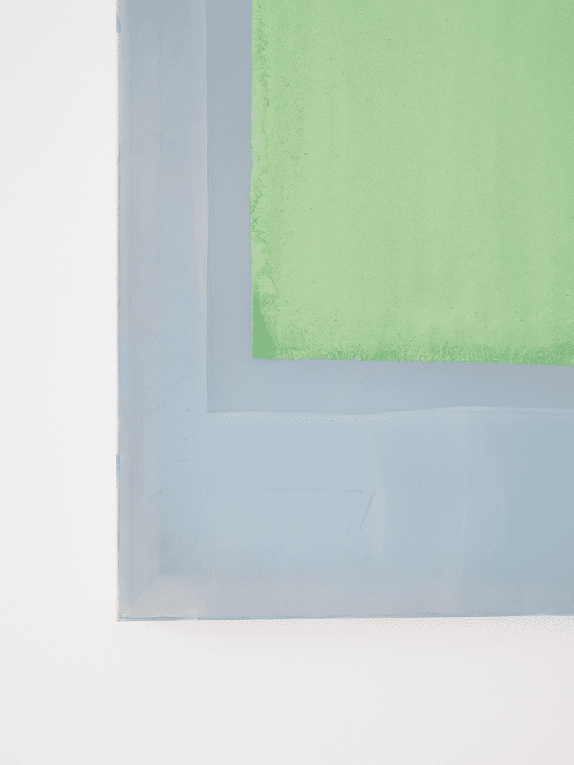 Composition of lemon green coloured paper on indigo blue